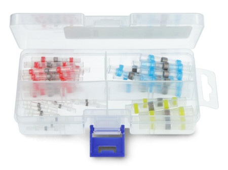 Lutownicze złącza termokurczliwe w różnych kolorach leżą w otwartym przezroczystym pudełku.
